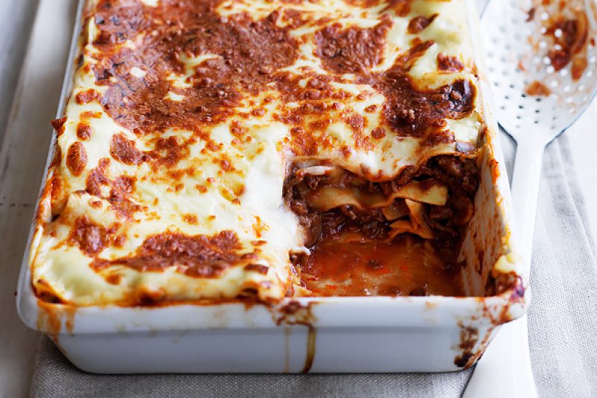 lasagna dish showcasing a tantalizing blend of savory meat and gooey cheese