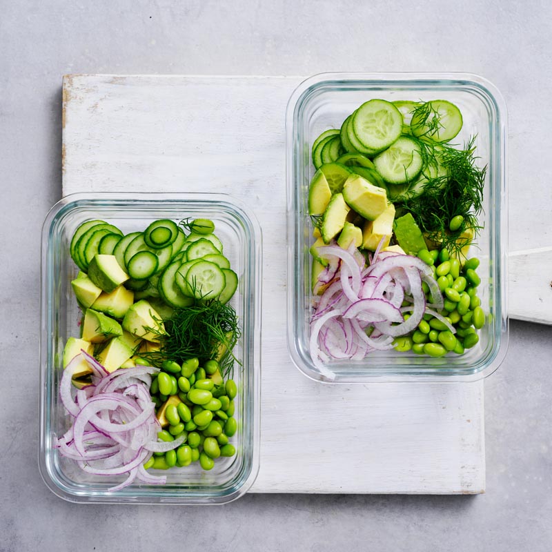 Salad ingredients divided between containers