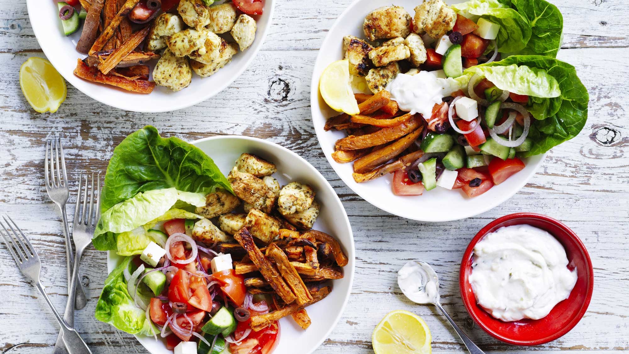 A colourful assortment of chicken and salad bowls