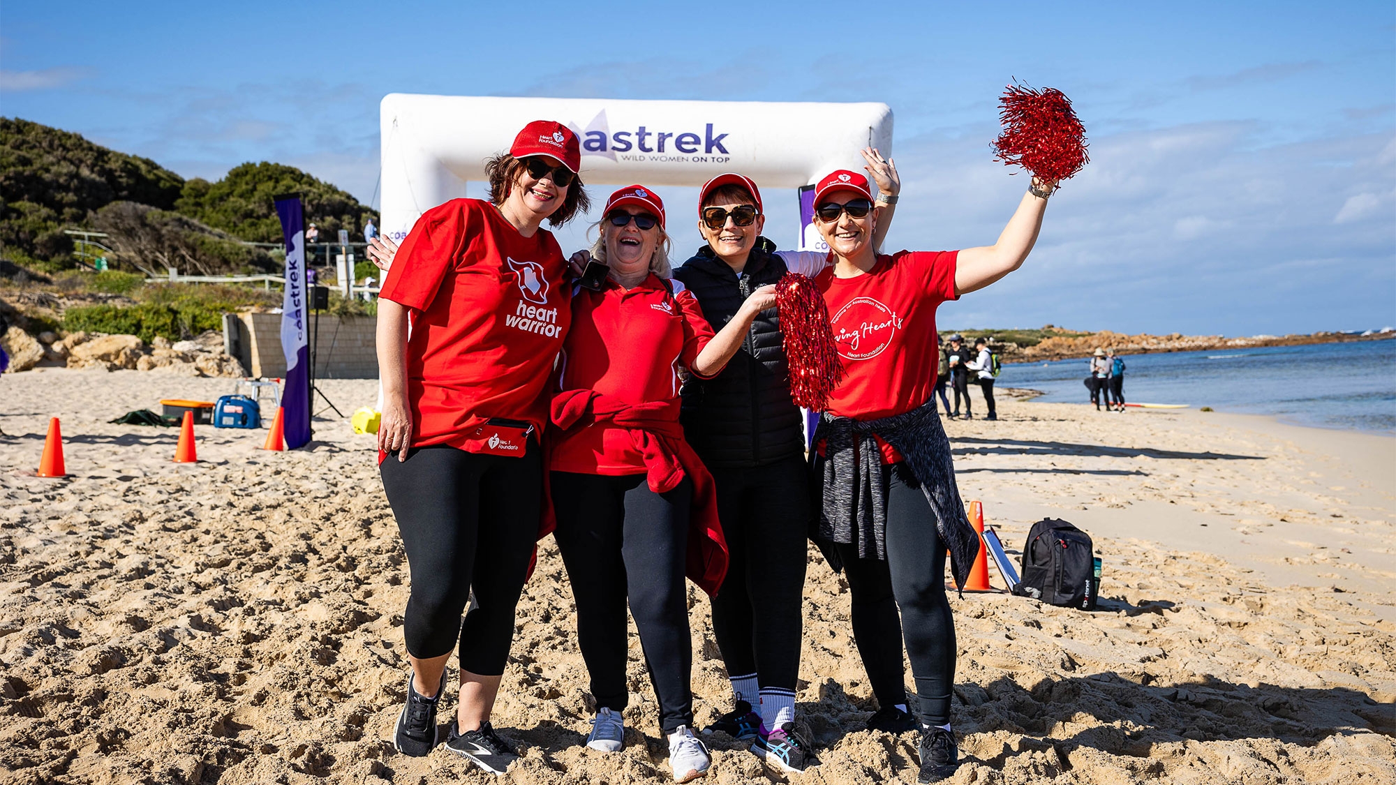 Heart Foundation team members smiling for a photo at a Coastrek event.