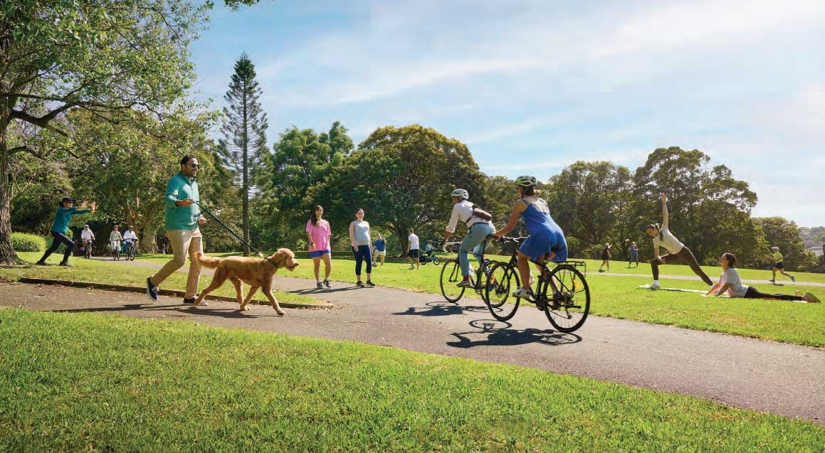 Outdoor sunny park scene with people walking, riding, and doing yoga