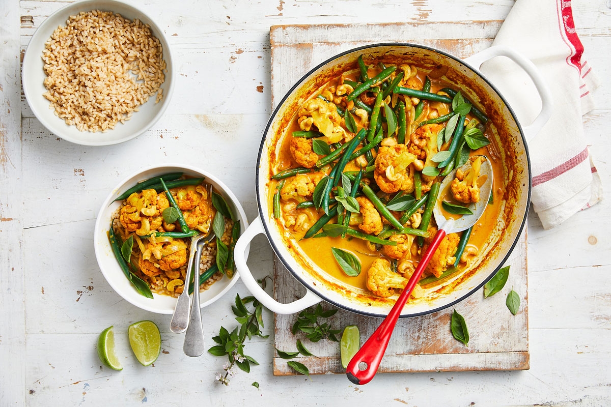 A delicious bowl of curry with green beans and rice