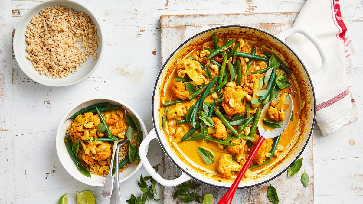 A delicious bowl of curry with green beans and rice
