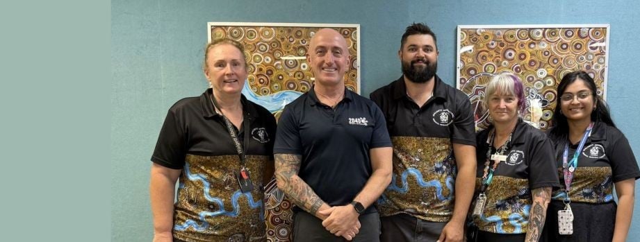 Five staff in matching polos