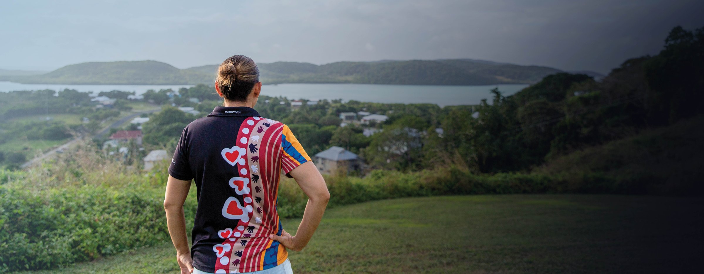Young First Nations woman looking out over landscape