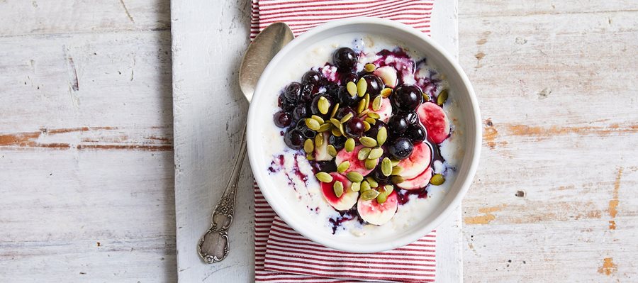 Blueberry and pumpkin porridge with a drizzle of honey