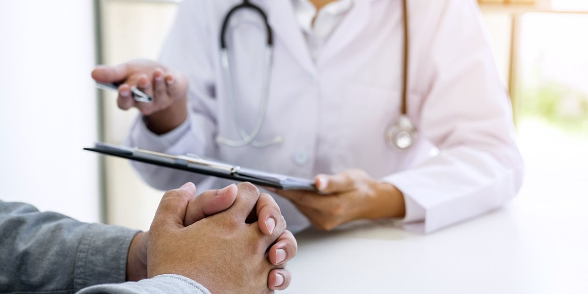 Doctor explaining patient using iPad