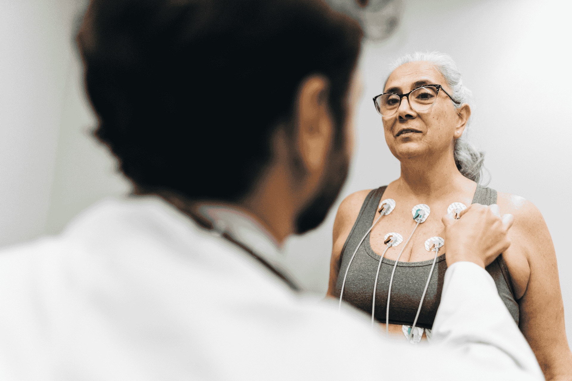 Patient talking with her doctor during a cardiopulmonary stress test on a hospital