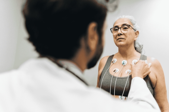Patient talking with her doctor during a cardiopulmonary stress test on a hospital