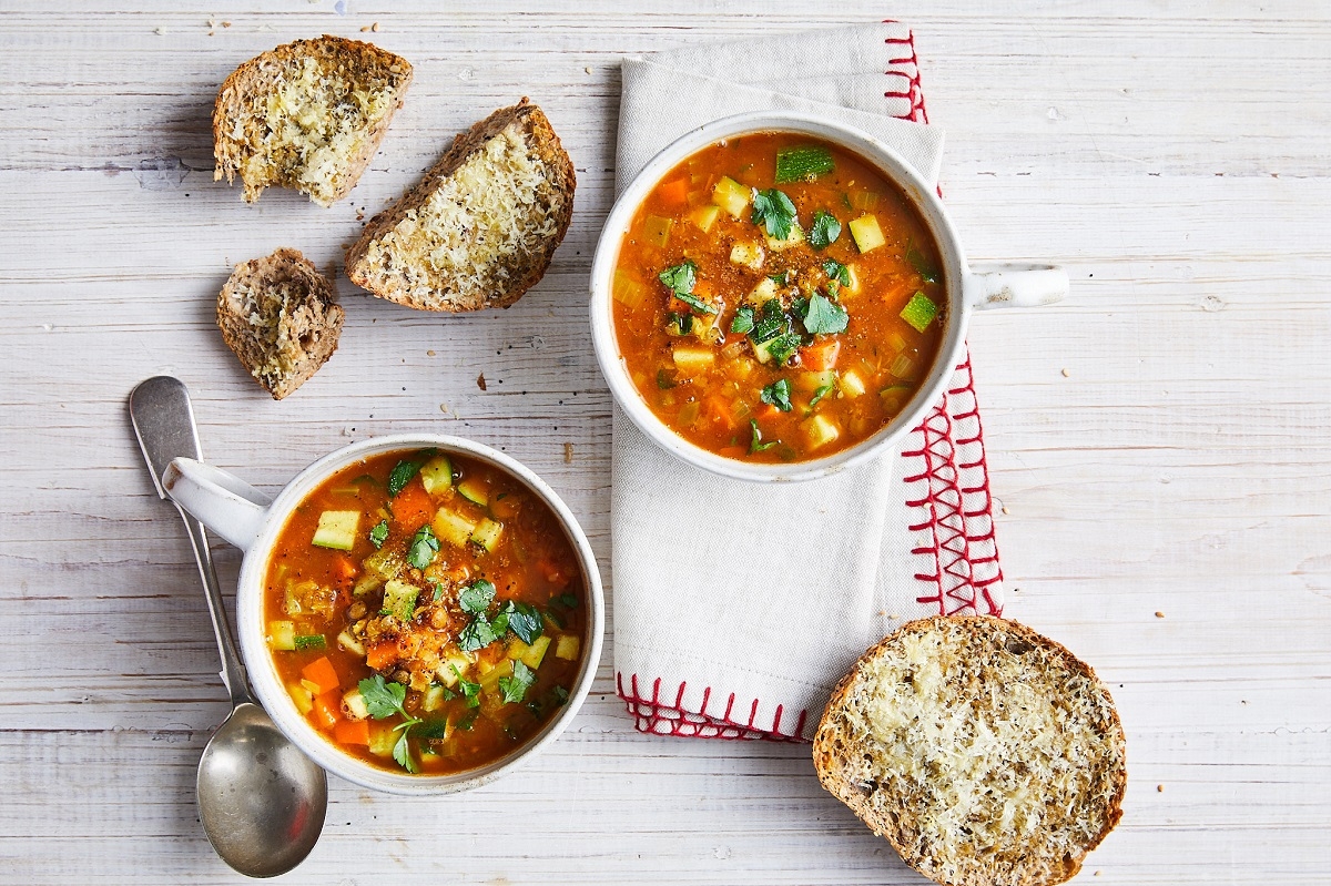 Hearty veggie lentil soup served in two bowls