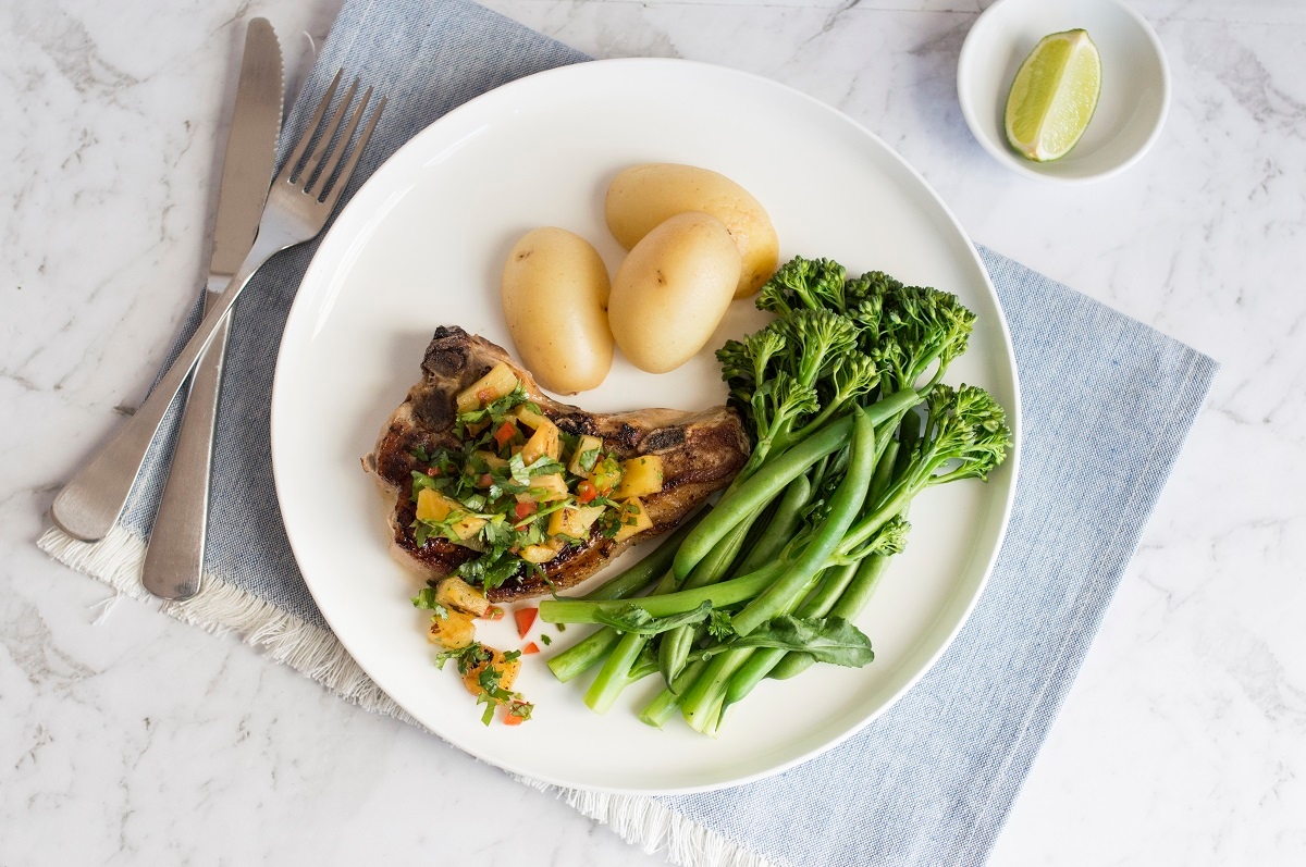  A plate of deliciously cooked pork, potatoes, and green beans