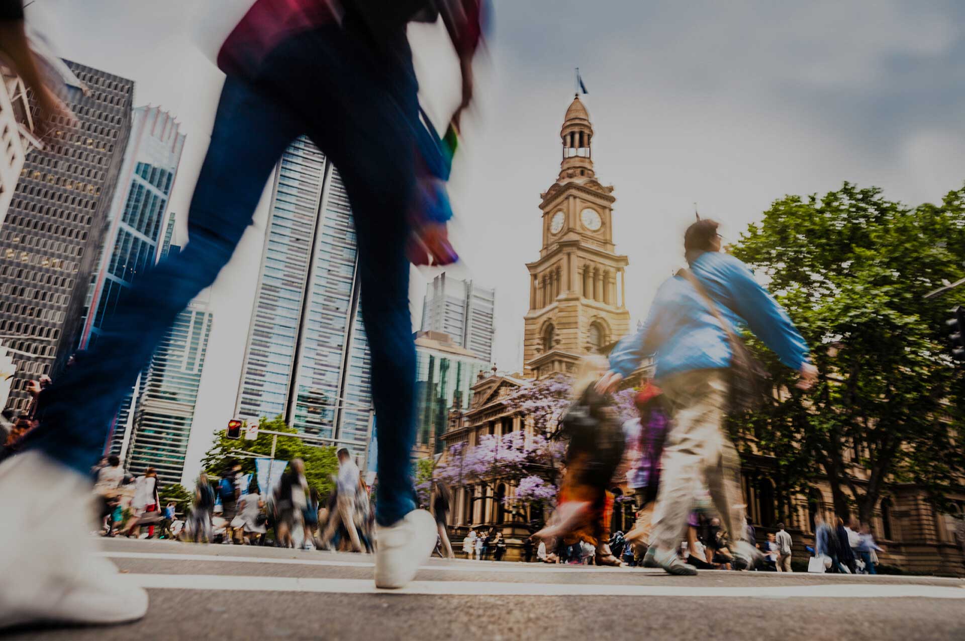 Bustling city street scene viewed from the ground looking up at passers by