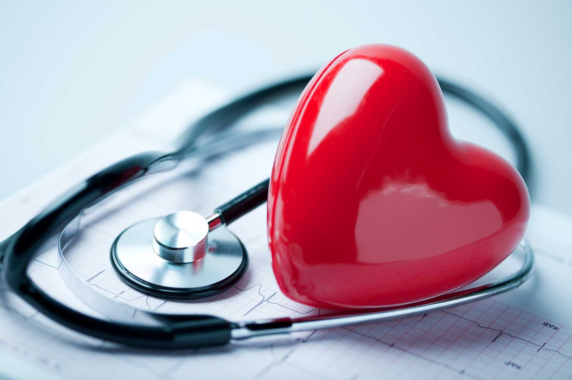 A heart shape on an electrocardiogram with a stethoscope.