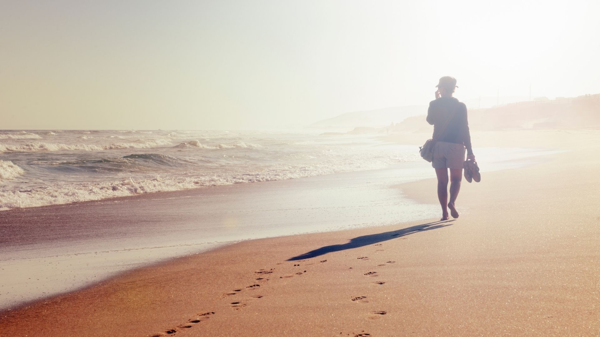 Woman walking on beach