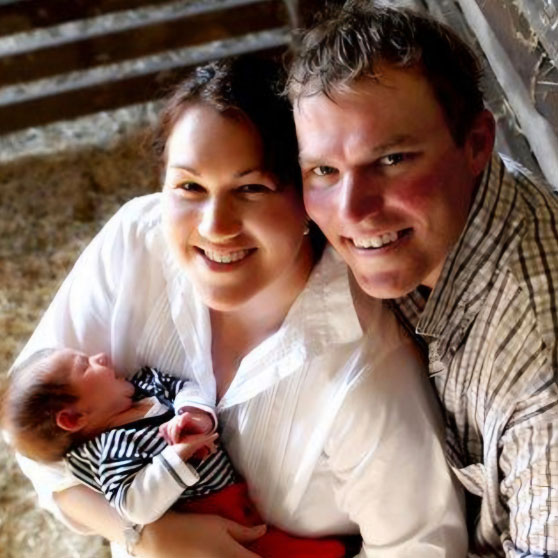 Tara and Shane holding their baby