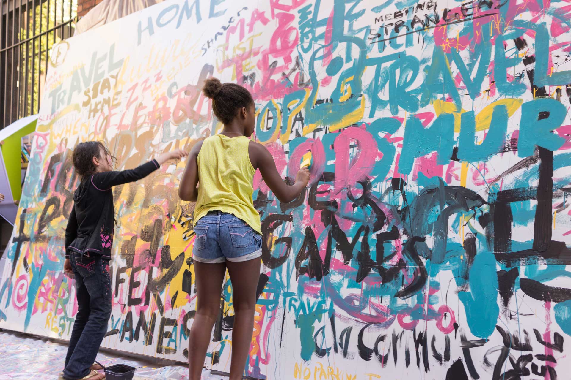 Young people working on a mural
