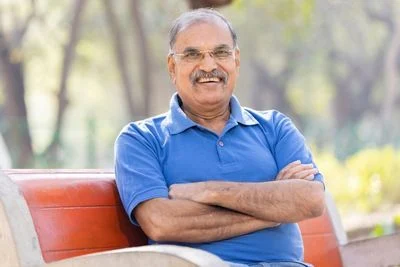 Man in blue shirt smiling