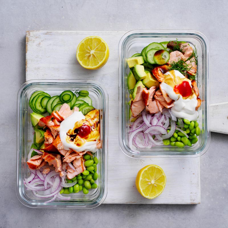 Salmon flaked over salad