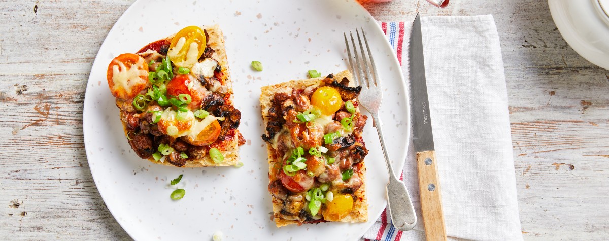 two slices of pizza, one with pepperoni and one with mushrooms