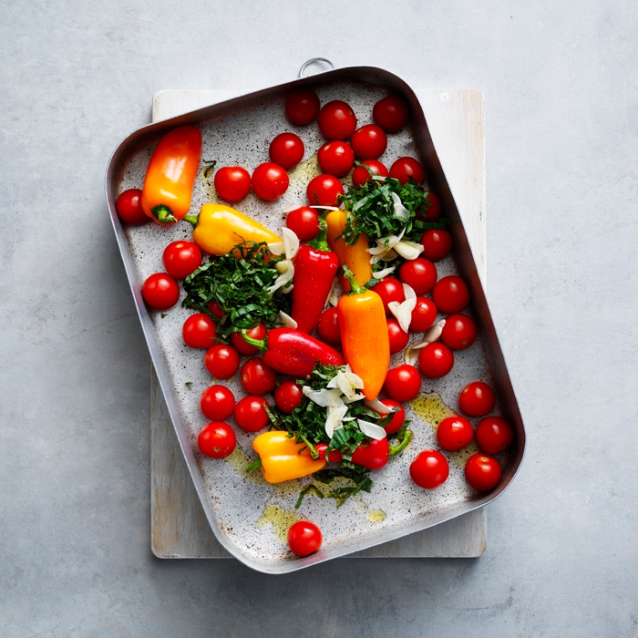 tomatoes, capsicums, shredded basil, garlic and 1 tablespoon oil in a roasting pan