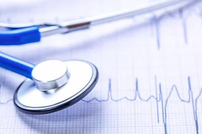 Stethoscope on top of medical graph piece of paper