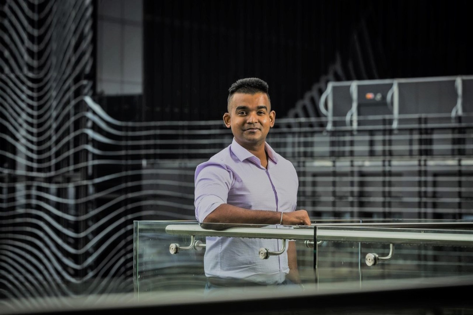 Man wearing shirt and posing for a photograph