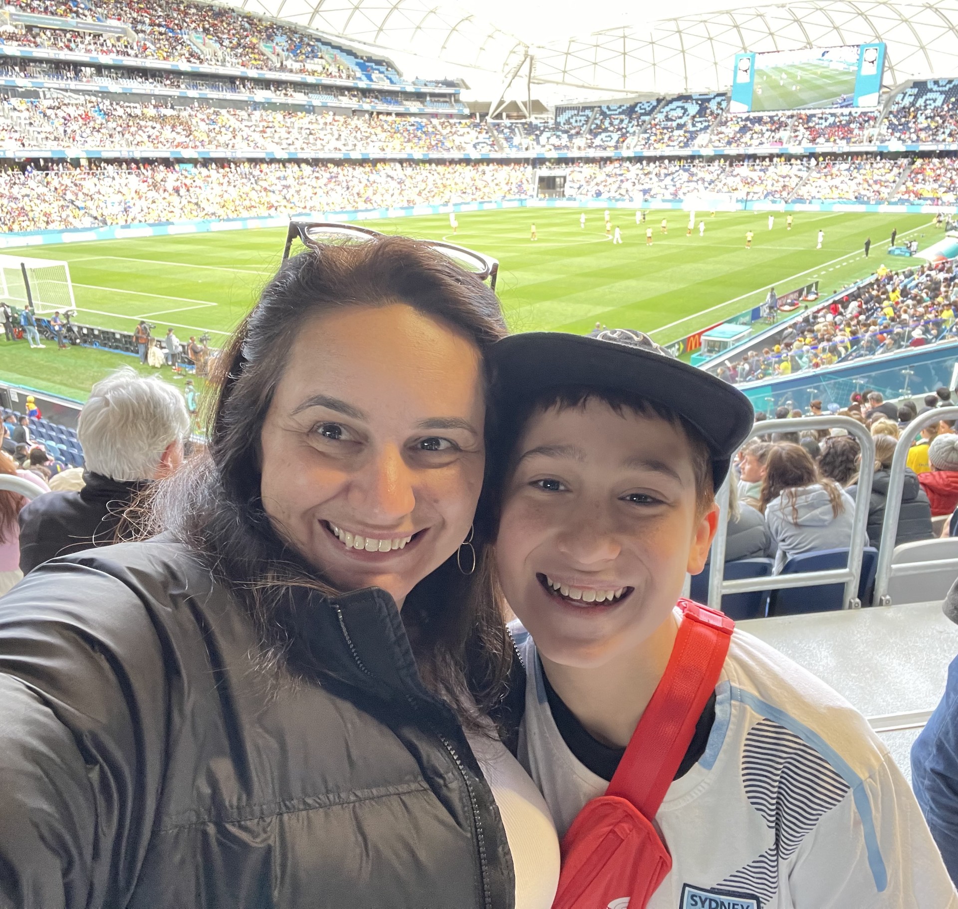 Anastastia and Felix Georgiou, a mother and son smiling in a selfie at the soccer