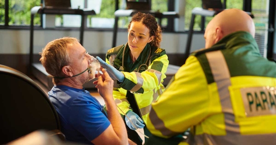 Man being treated with oxygen by paramedics
