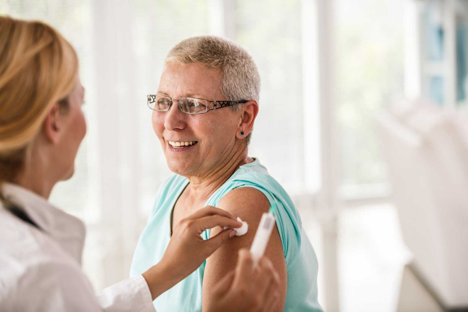 A woman receiving a flu vaccine