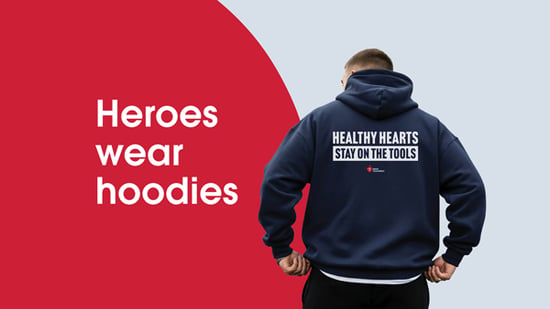 A man in a dark blue hoodie which says "Healthy hearts stay on the tools"