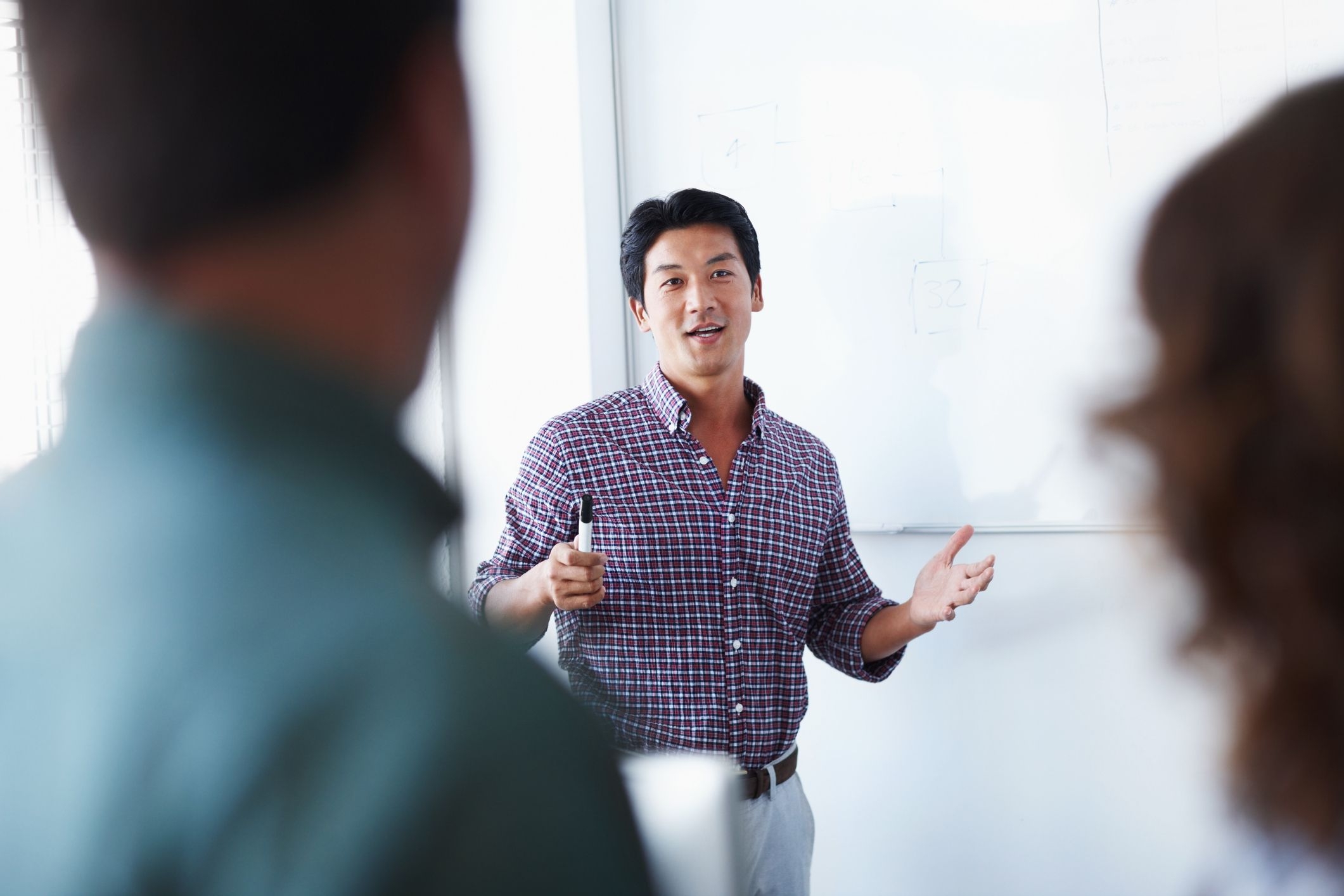 A researcher presenting at a research conference