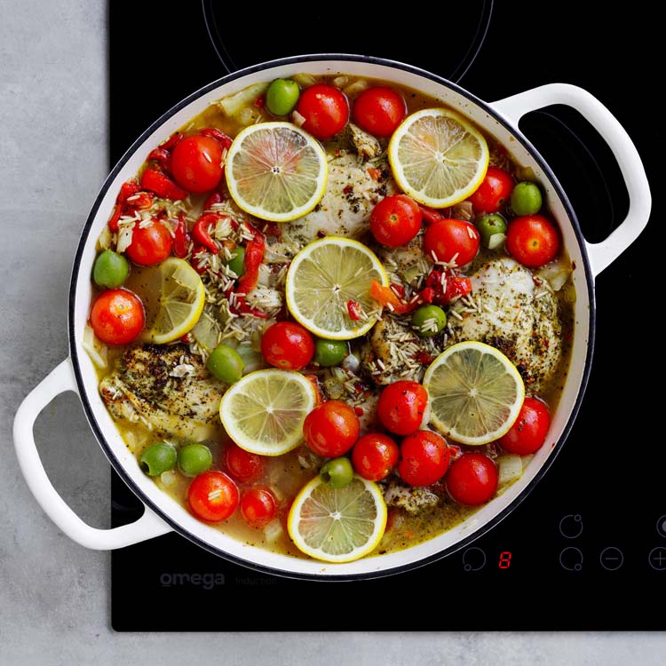Finished one pan chicken and rice topped with lemon slices and parsley