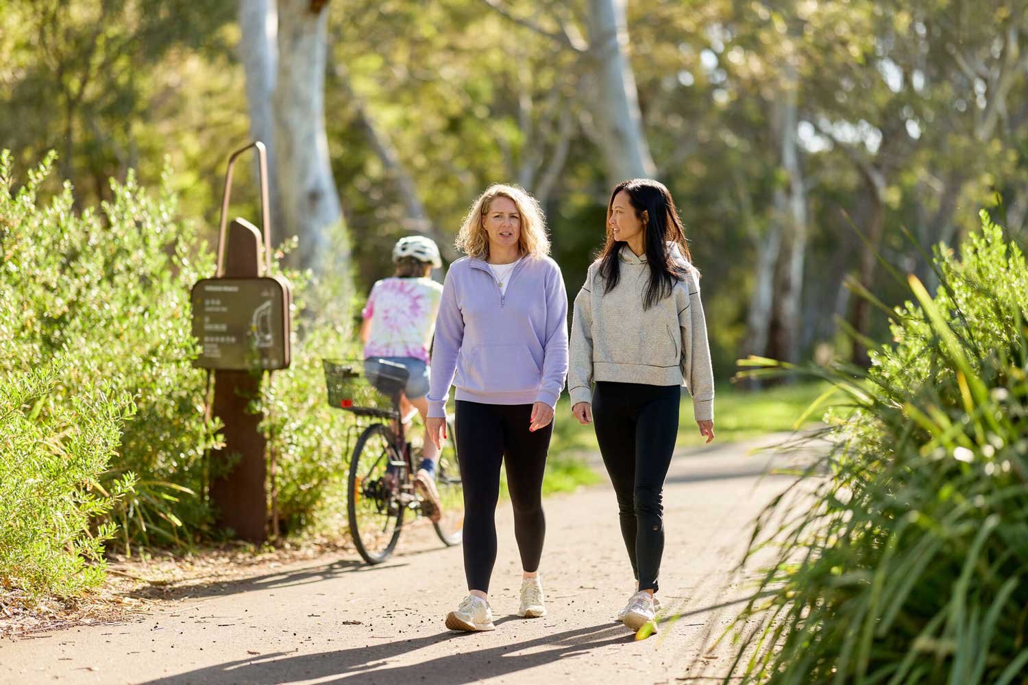 people walking in active wear in a park outdoor setting