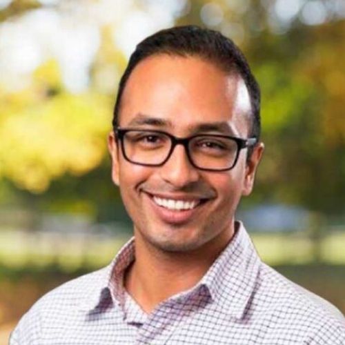 Heart disease researcher Associate Professor Nitesh Nerlekar smiling standing outside