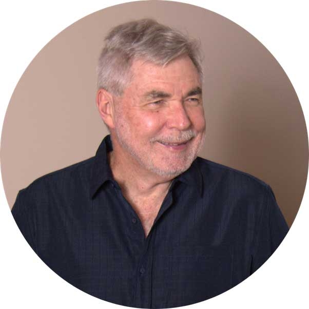 Smiling man in a dark blue shirt, Greg 