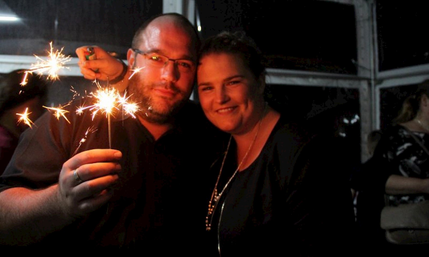 Man and Woman doing sparkler fireworks