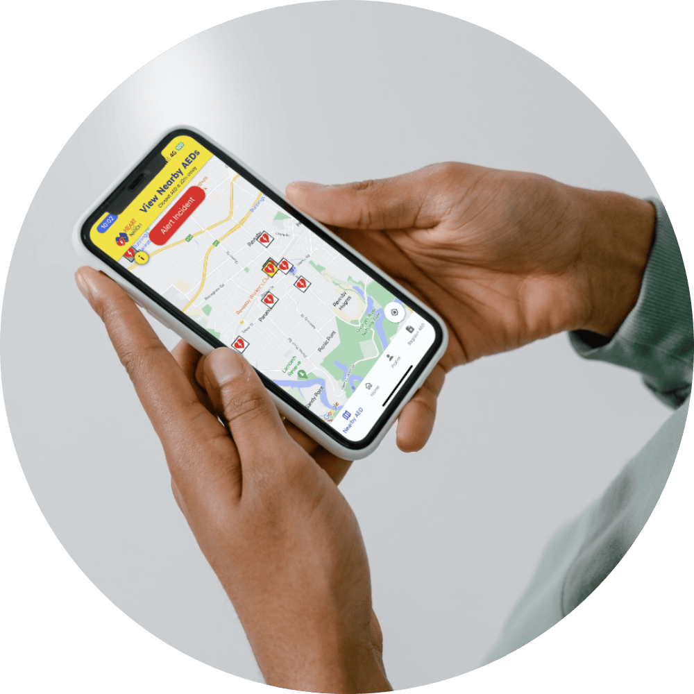 Computer and phone mock-ups of the bright yellow Heart of the Nation app