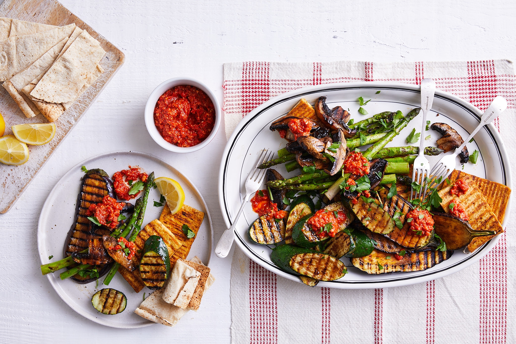 Grilled vegetables and bread arranged on a table