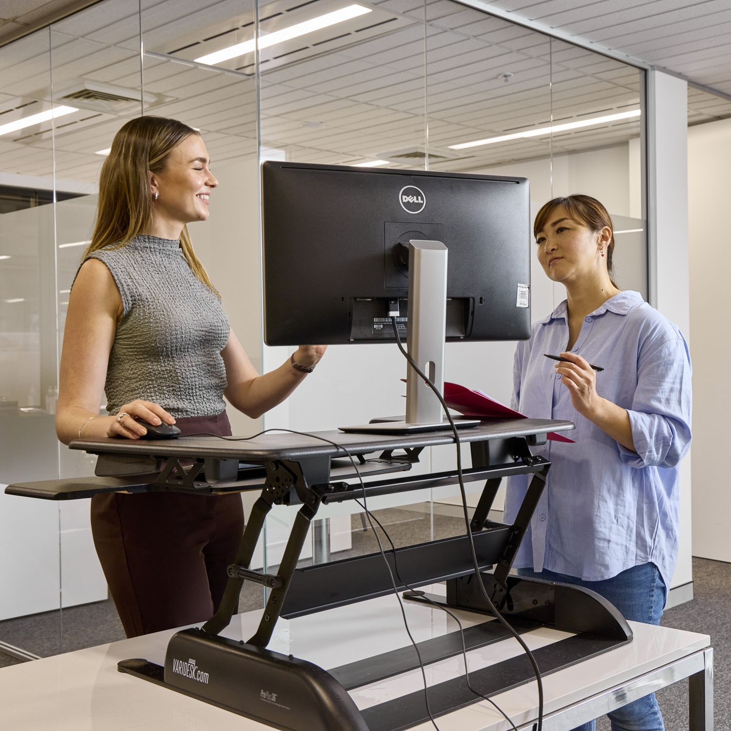 Two people speaking in an office