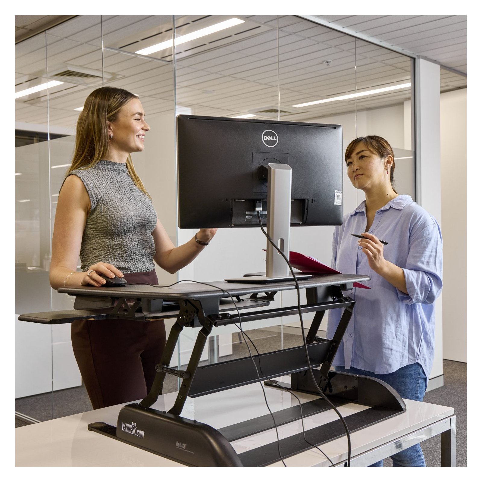 Two people speaking in an office