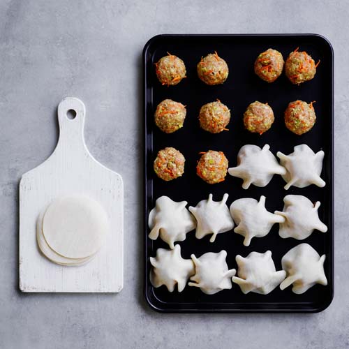 Rolling dumpling mixture into balls