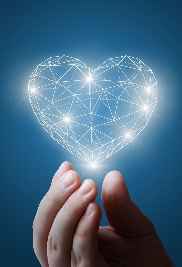 Hand holding a heart shape light