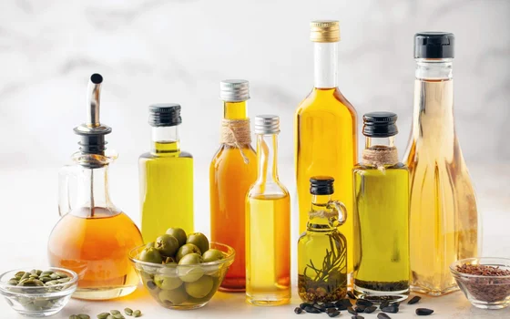 A range of glass bottles with different coloured oils