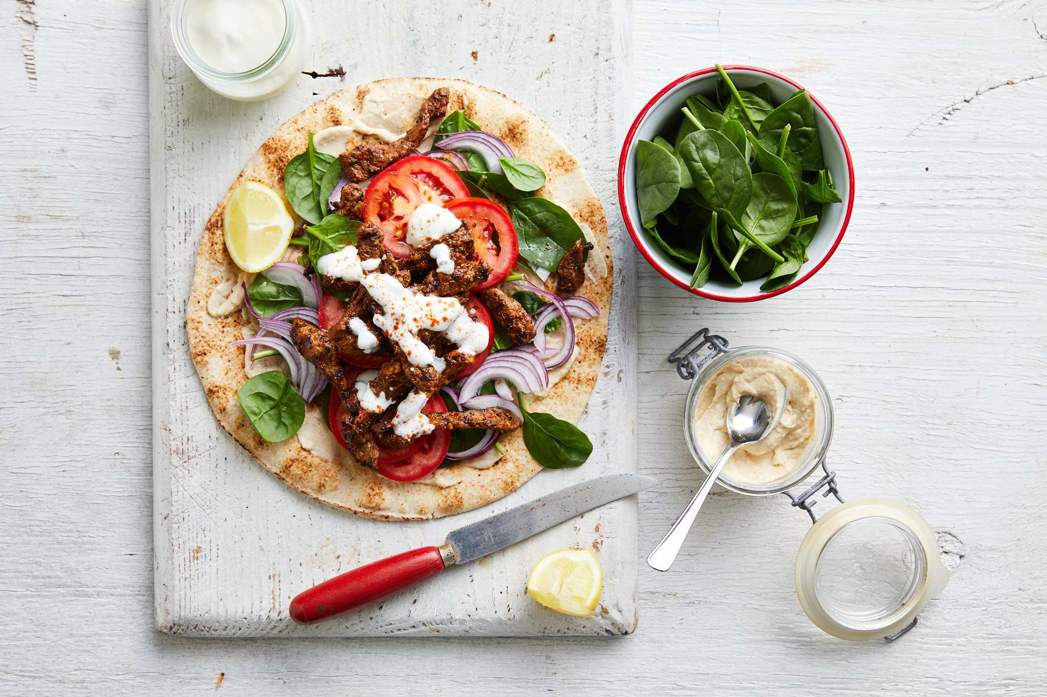  mouthwatering souvlaki featuring lamb, colorful vegetables, and salad