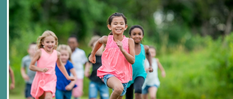 Kids running through a field