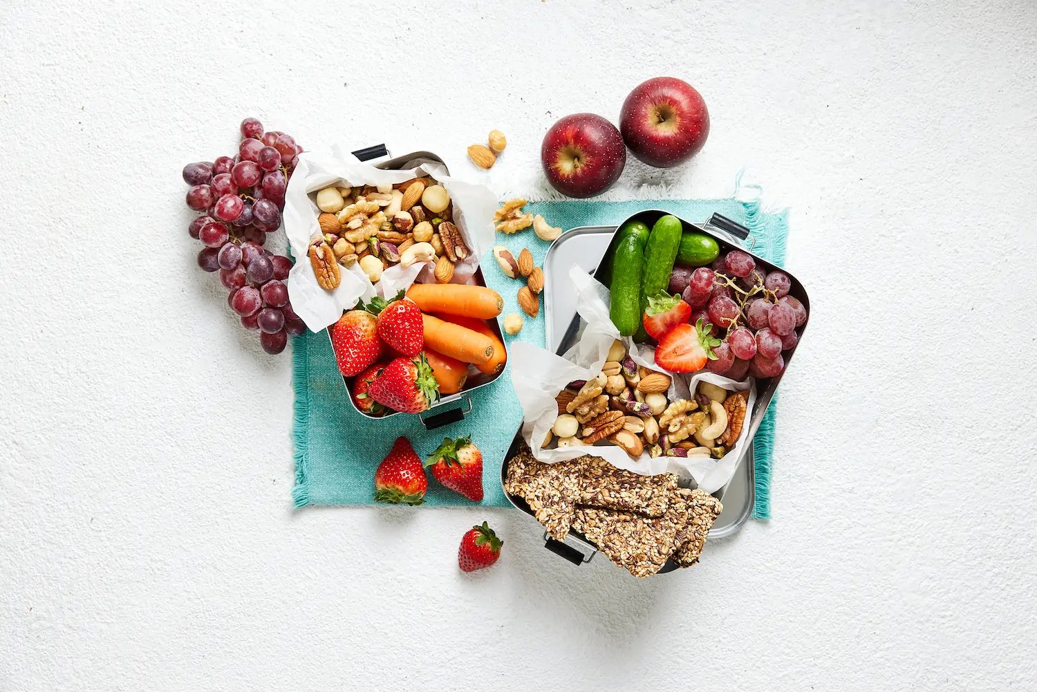 Mixed nuts, fruit and crackers on plate