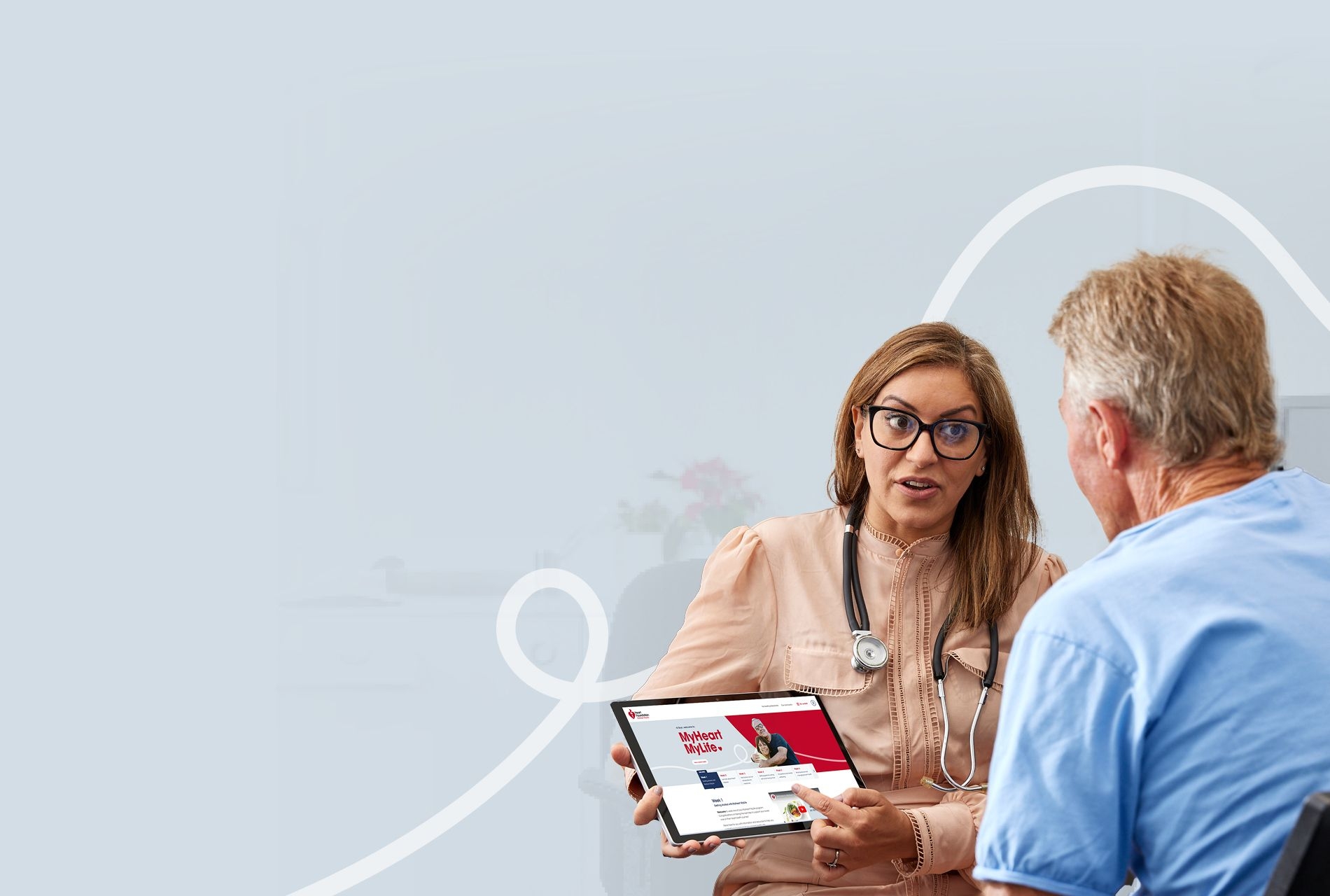 A doctor talking to their patient about the MyHeart MyLife