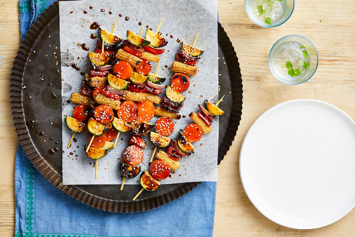 A plate displaying a colorful array of skewers