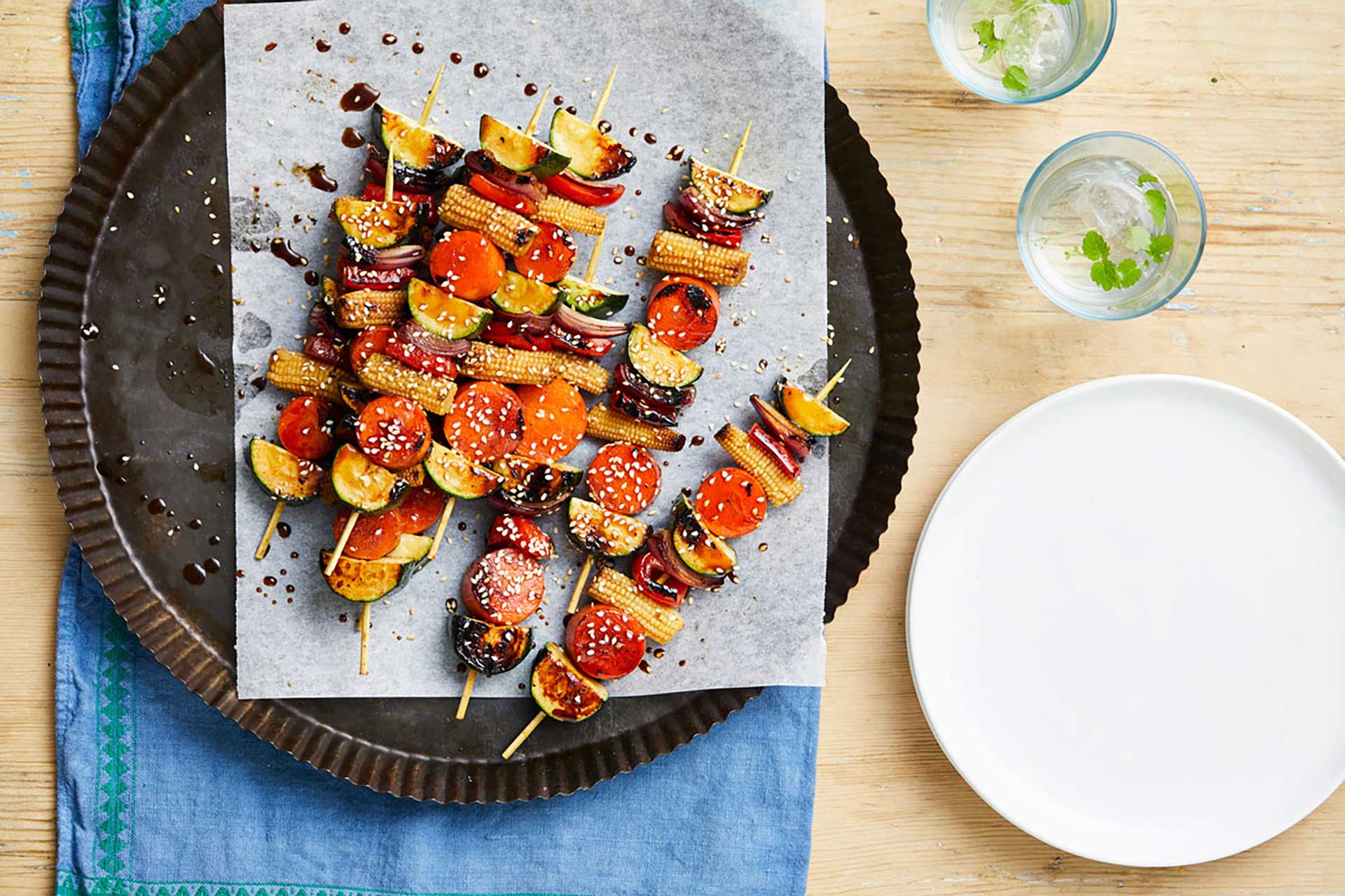 A plate displaying a colorful array of skewers