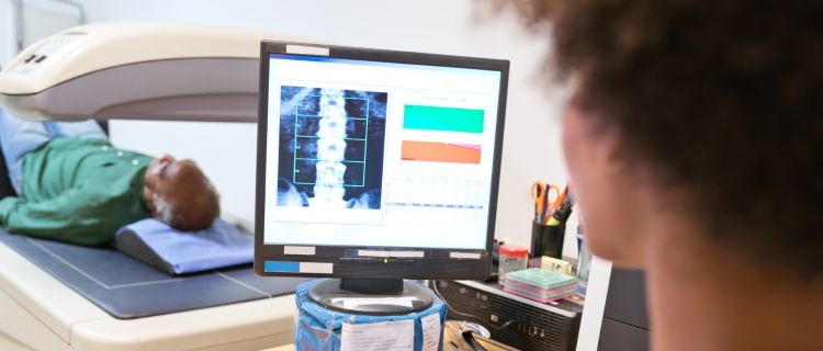 A researcher looking at a computer screen